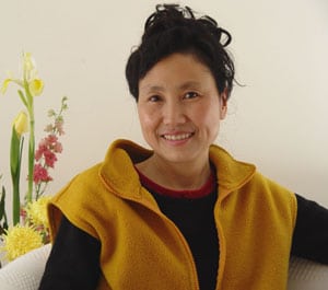 Ms. Wang Weixing, shown here in a 2007 photo, is a painter who graduated from San Franciscos Academy of Art University and now lives in Queens. Ms. Wang was physically assaulted in Flushing, New York by a member of a pro-Beijing mob.