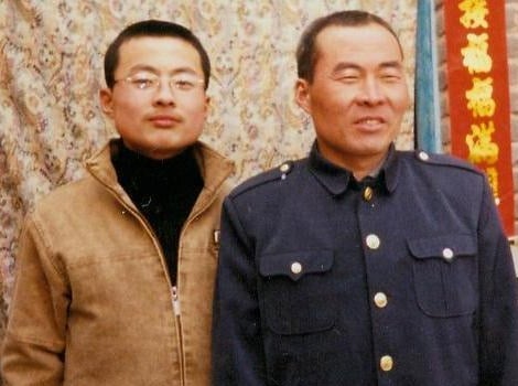 Mr. Li Lankui and his son. Li was abducted by police in Hebei province in June ahead of a visit to the region by Iowa governor Terry Branstad