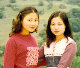 Helen Peng (right) received news on Christmas Eve that her twin sister Tianxiong (left) was released from a labour camp in China, where she had been illegally detained for practicing Falun Gong. Helen praises the efforts of the Global Rescue campaign and the Canadian Government.