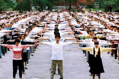 A MORNING STRETCH: Residents of Sichuan province perform the first exercise of Falun Gong. Millions in China discovered the powerful health benefits of the practice in the 1990s.