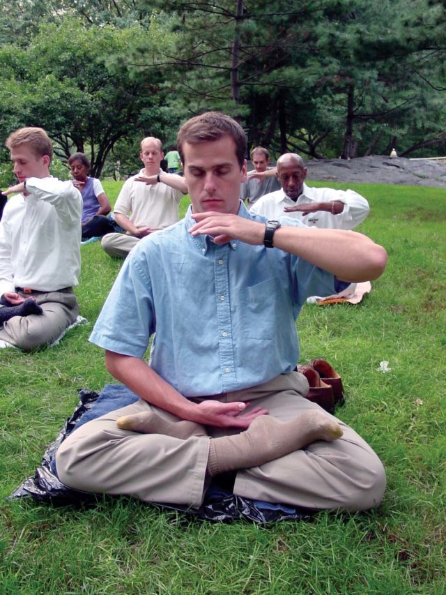 An American student of Falun Gong performs the practices meditation,  tapping into a many centuries old Chinese tradition.