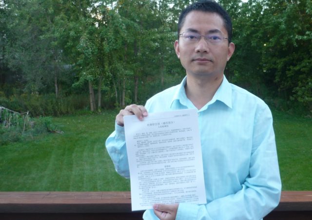 Huang Kui holds up a copy of a complaint that he submitted to Chinese courts together with 34 other people affliliated with the prestigious Tsinghua University who like him have suffered persecution for practicing Falun Gong. The complaint charges former Communist Party leader Jiang Zemin with illegal imprisonment, torture, and a dozen other crimes committed in the campaign against Falun Gong. It is one of over 160,000 such complaints submitted to Chinese courts since May.