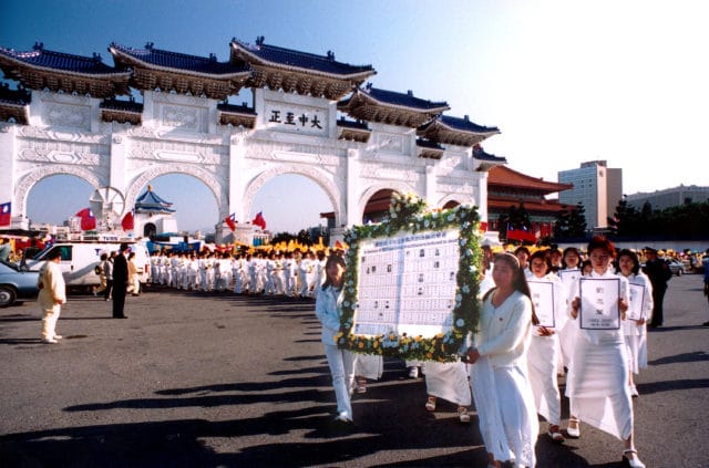 (Pictured: Falun Gong practitioners in Taiwan hold a parade to remember those who were killed by the Chinese Communist Party since July 20, 1999.)