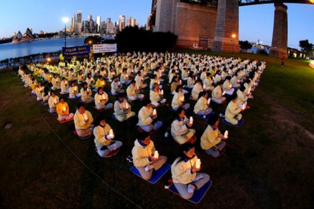 Falun Gong practitioners hold a candlelight vigil in Sydney July, 2013 to mark the 14th anniversary of the beginning of the Falun Gong persecution. Getty Images