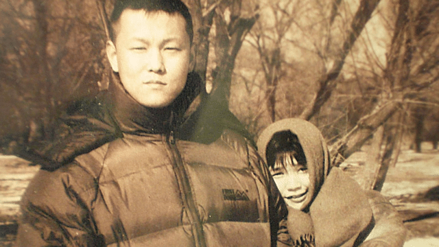 Ms. Xu Na (above, right) pictured with her late husband, Mr. Yu Zhou (above, left). Yu was arrested in Beijing shortly before the 2008 Beijing Olympics and died in police custody several days later. Xu was imprisoned and tortured for several years following her husband's death.