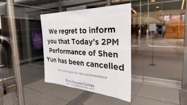 A sign taped on the front door of the Four Seasons Performing Arts Center on March 29, 2026, ahead of Shen Yun’s third scheduled performance in Toronto. (Cynthia Sun/Falun Dafa Information Center)