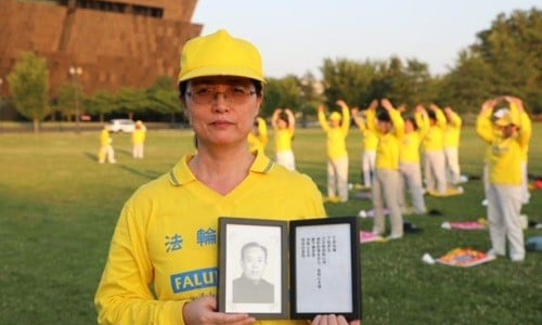 Stephanie Zhang with a photo of her father, a victim to the persecution of Falun Gong in China.