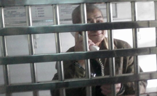 Mr. Liao Songlin handcuffed in the visitors room of the 7th Ward of Jinshi Prison, 2008.