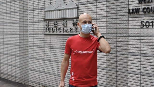 Hu Aimin outside West Kowloon Magistrates' Court in Hong Kong (Sung Pi-Lung/The Epoch Times)