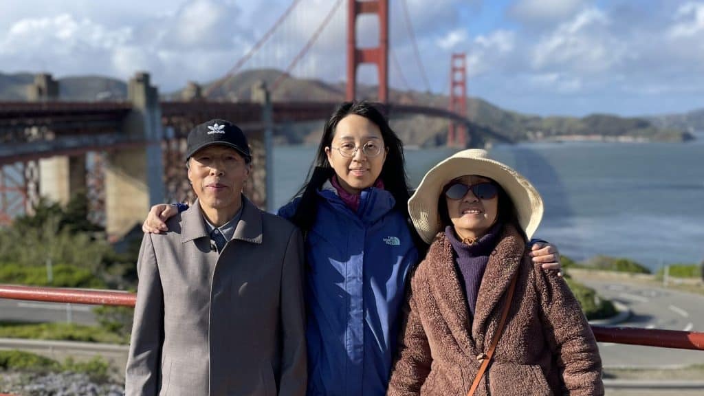 California resident Yolanda Yao pictured with her parents at the Golden Gate Bridge on February 2023.