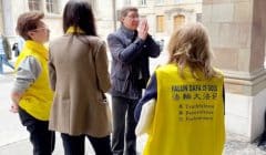 Mauro Poggia, president of the Council of State of Geneva shows his respect to Falun Dafa practitioners on April 28, 2023 in Geneva’s Old Town, Switzerland.