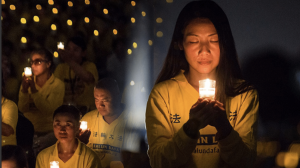 Falun Gong practitioners at the annual candlelight vigil in Washington, D.C. on the anniversary of the persecution in 2017 honoring fellow believers in China who have died during the persecution.