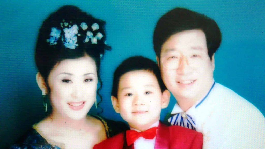 Family photo of Mr. Pang You (right) with his wife and son