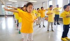 Participants at the 2022 Minghui Summer Camp in Toronto do daily group exercises. (Source: Minghui)