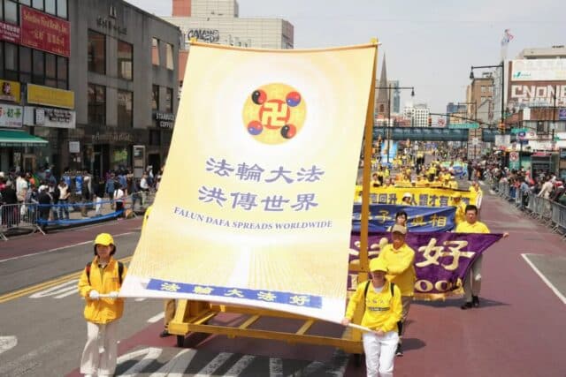 Falun Gong practitioners participate in a parade in Flushing, New York, on April 19, 2025, to commemorate the 26th anniversary of the April 25 appeal. (Larry Dye/The Epoch Times)