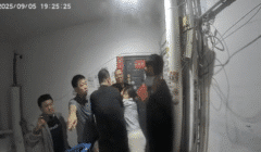 Doorbell footage shows Chen Zhongli (陈忠丽), an elderly mother in Shanxi, surrounded by multiple plainclothes officers moments before they break into her front door.