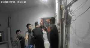 Doorbell footage shows Chen Zhongli (陈忠丽), an elderly mother in Shanxi, surrounded by multiple plainclothes officers moments before they break into her front door.