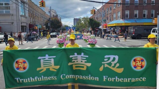 Falun Gong practitioners hold a parade at the Eighth Avenue in Brooklyn, New York on August 23, 2026. (Photo: Lotus team)